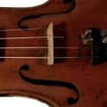 Violin has etiquette with the inscription "EUGENIO PRAGA Premiado con Medaglia Fece in 1893, ,