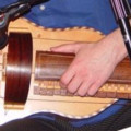 Hurdy Gurdy, flat back with guitar-shaped body made by Richard Smith, in black coffin-shaped case, , ,